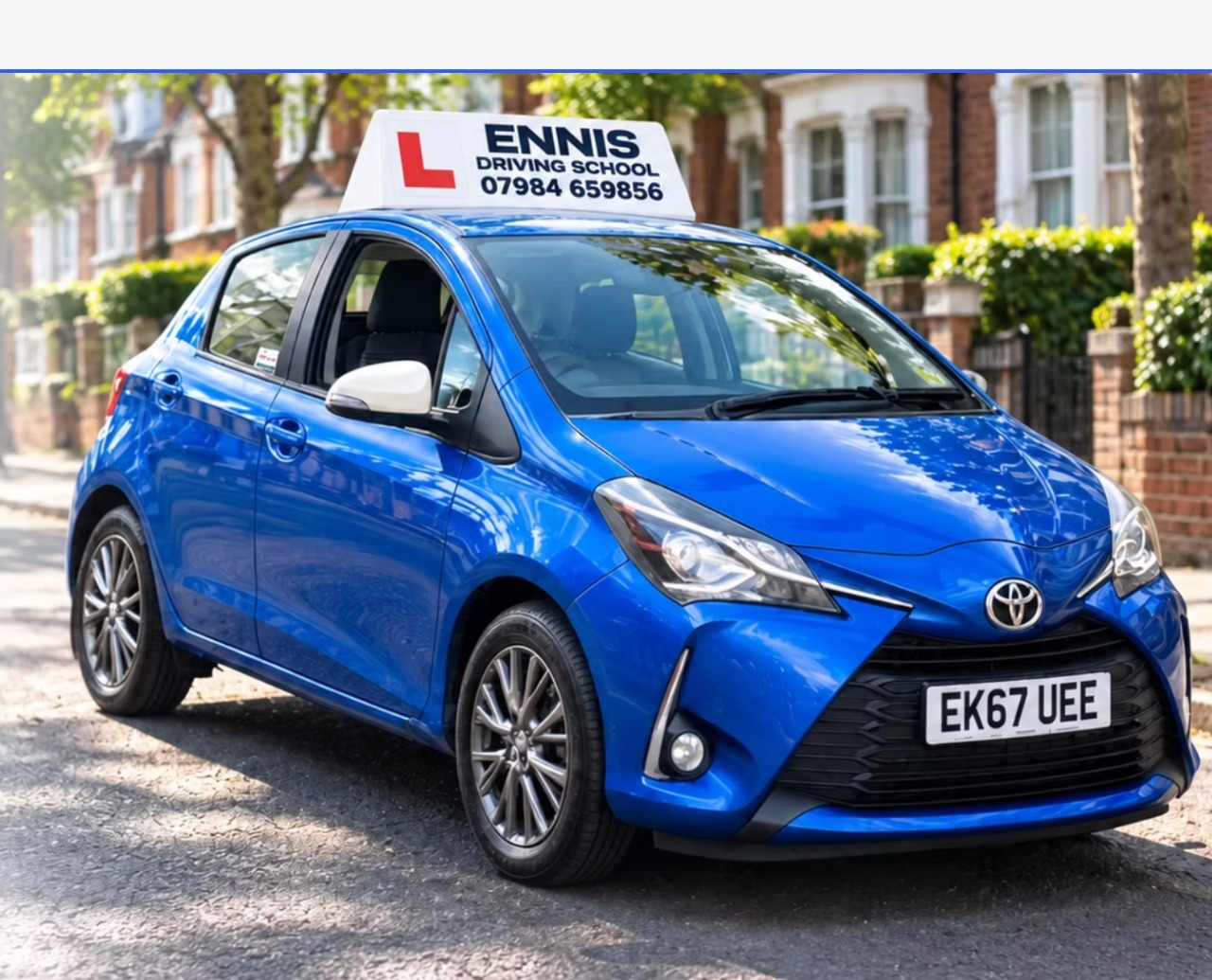 Blue Ennis Driving School learner car on a London street